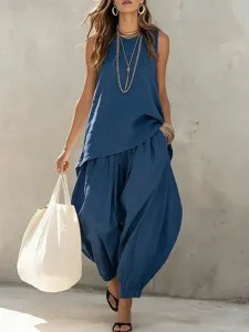 Detail view of casual cotton linen sleeveless top and harem pants set in deep blue color.