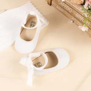 White velvet baby princess shoes with cute bow soft sole infant toddler shoes detail.