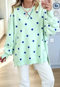 Green polka dot sweatshirt for women, loose casual long sleeve crewneck pullover with side split.