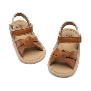 Cute brown baby sandals with bowknot, comfortable soft sole toddler shoes detail view.