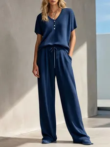 Navy blue waffle knit lounge set featuring a V-neck short sleeve top and drawstring pants.