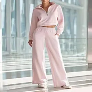 Casual pink half-zip cropped sweatshirt and wide-leg trousers two-piece set detail view.