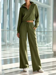 Detail view of the olive green half-zip cropped sweatshirt and wide-leg cargo pants set.