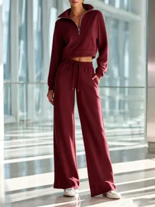 Detail view of women maroon half-zip cropped sweatshirt and wide leg lounge pants.