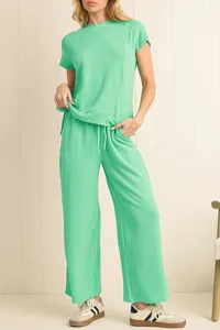 Detailed view of women casual ribbed two-piece set, short sleeve top and wide leg pants.