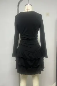 Women's black long sleeve slim fit mini dress with ruched waist and tiered ruffle hem.