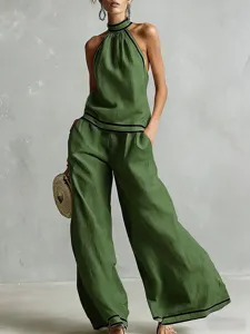 Green halter sleeveless top and wide leg pants set for women summer vacation casual wear.