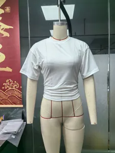 Detail view of women's slim fit solid color round neck short sleeve t-shirt with side ruched design.