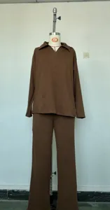 Detailed view of the solid color autumn winter long sleeve polo top and wide leg pants set.