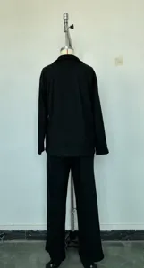 Detailed back view of the black solid two-piece autumn winter casual outfit mannequin display.