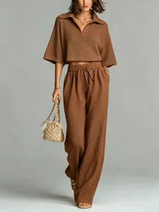 Brown waffle knit two-piece set, polo collar crop top and high-waist wide-leg pants.