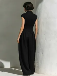 Black sleeveless lapel high waist wide leg jumpsuit for women elegant summer resort wear.
