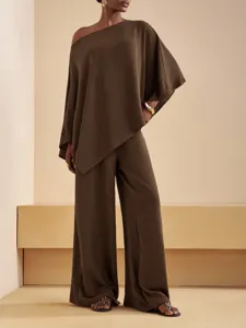 Elegant European women's two-piece set featuring off-shoulder top and wide-leg pants.
