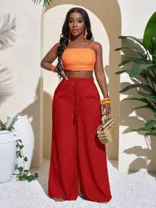 Detailed view of the women's solid textured wide-leg pants with drawstring high waist design.