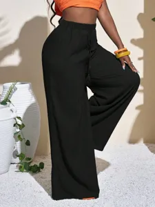 Solid textured wide-leg pants for women, high-waisted drawstring casual beach trousers.