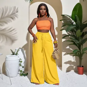 Solid color textured wide leg pants and crop top set for women, high waist casual beach wear.