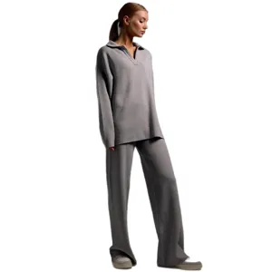 Stylish women's solid color knit polo sweater and wide-leg pants two-piece set for autumn winter.