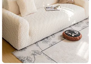 Detailed close-up view of the beige textured leaf pattern universal stretch sofa cover.