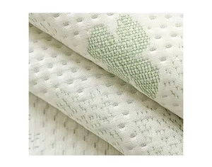 Close-up detail of cooling ice silk sofa cushion fabric with cute woven cartoon pattern texture.