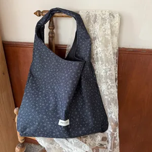 Detailed view of the Korean style floral shoulder shopping bag, featuring soft fabric and vintage aesthetic.