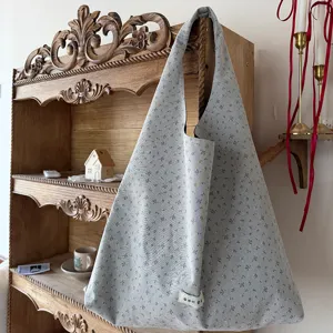 Detail view of the stylish floral canvas shoulder tote bag, showing soft fabric texture.