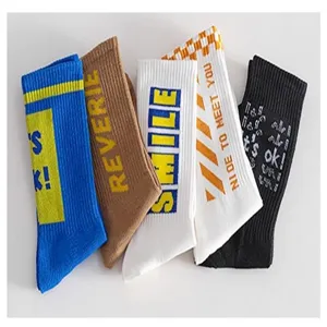 Detailed view of stylish cotton crew socks with trendy letter prints and colorful designs.