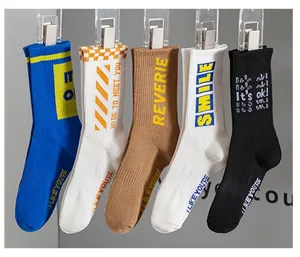 Men's stylish mid-tube cotton socks with various trendy letter prints for casual daily wear.