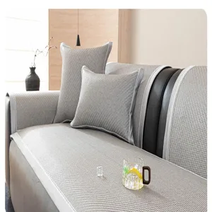 Close-up detail of cooling rattan sofa mat texture, showing fine weave and sleek border design.