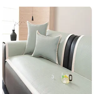Cooling rattan sofa cushion detail showing smooth surface texture and elegant white piping.