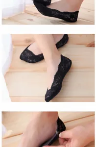 Close-up detail of women's black lace invisible boat socks featuring breathable cotton sole.