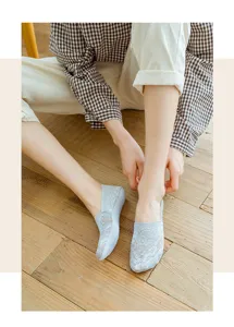 Detail view of grey lace boat socks for women, breathable cotton bottom design for daily wear.