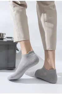 Detailed view of breathable light grey mesh short socks worn by a model, perfect for summer.