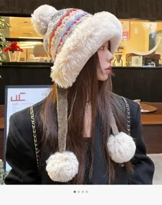 Cute plush knitted winter hat with earflaps and pom poms thick warm fuzzy cap for women.