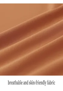Vue rapprochée de la texture du tissu respirant et doux pour la peau en orange vif.