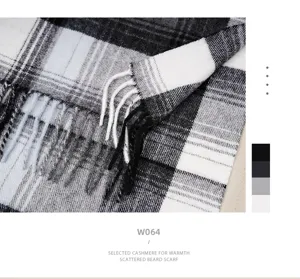 Close-up of black and white plaid winter scarf fringe detail soft warm fabric texture.
