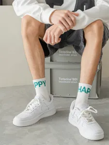 Men white mid-tube socks with green happy letter print, comfortable cotton streetwear socks.