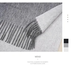 Double-sided cashmere wool winter scarf detail with soft fringe and warm knitted texture.
