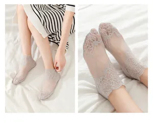 Detail shot of women's grey mesh lace short socks, featuring delicate floral embroidery design.