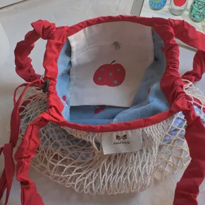 Spring summer new mesh bucket shoulder bag with red strap and cute inner apple pouch detail.