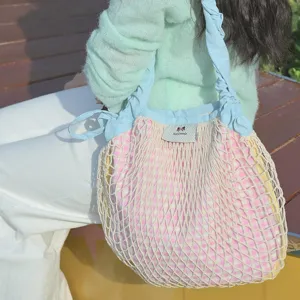 Spring new nylon plaid mesh shoulder crossbody drawstring dopamine bag detail view.
