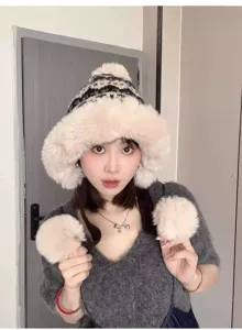 Cozy fuzzy winter plush hat with warm earflaps and cute pom-poms for cold weather.