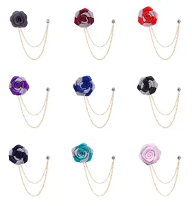 Detailed view of men's fabric rose lapel pins with double chains, perfect for suits and weddings.