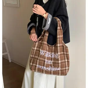 Brown plaid woolen shoulder bag with embroidered letter design for daily women use.