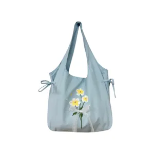 Zoete stijl lichtblauwe schoudertas met schattige strikken en mooie bloemenprint voor dames.