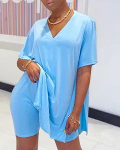 Casual solid V-neck batwing sleeve split top and shorts set for women. Summer outfit.