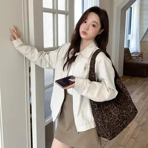 Detail view of the stylish leopard print woolen tote bag in a modern indoor lifestyle setting.