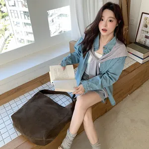 Detailed view of the 2025 early autumn new niche design woolen fabric shoulder tote bag.