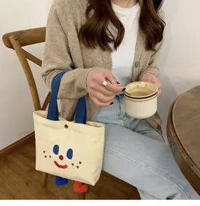 Joli sac à lunch en toile sac fourre-tout bento petite pochette étudiante visage drôle.