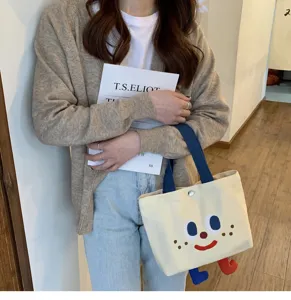 Sac à lunch en toile mignon avec visage de dessin animé drôle et petits pieds, fourre-tout.