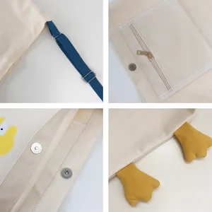 Canvas shoulder bag with adjustable blue strap, large capacity tote bag with duck design.